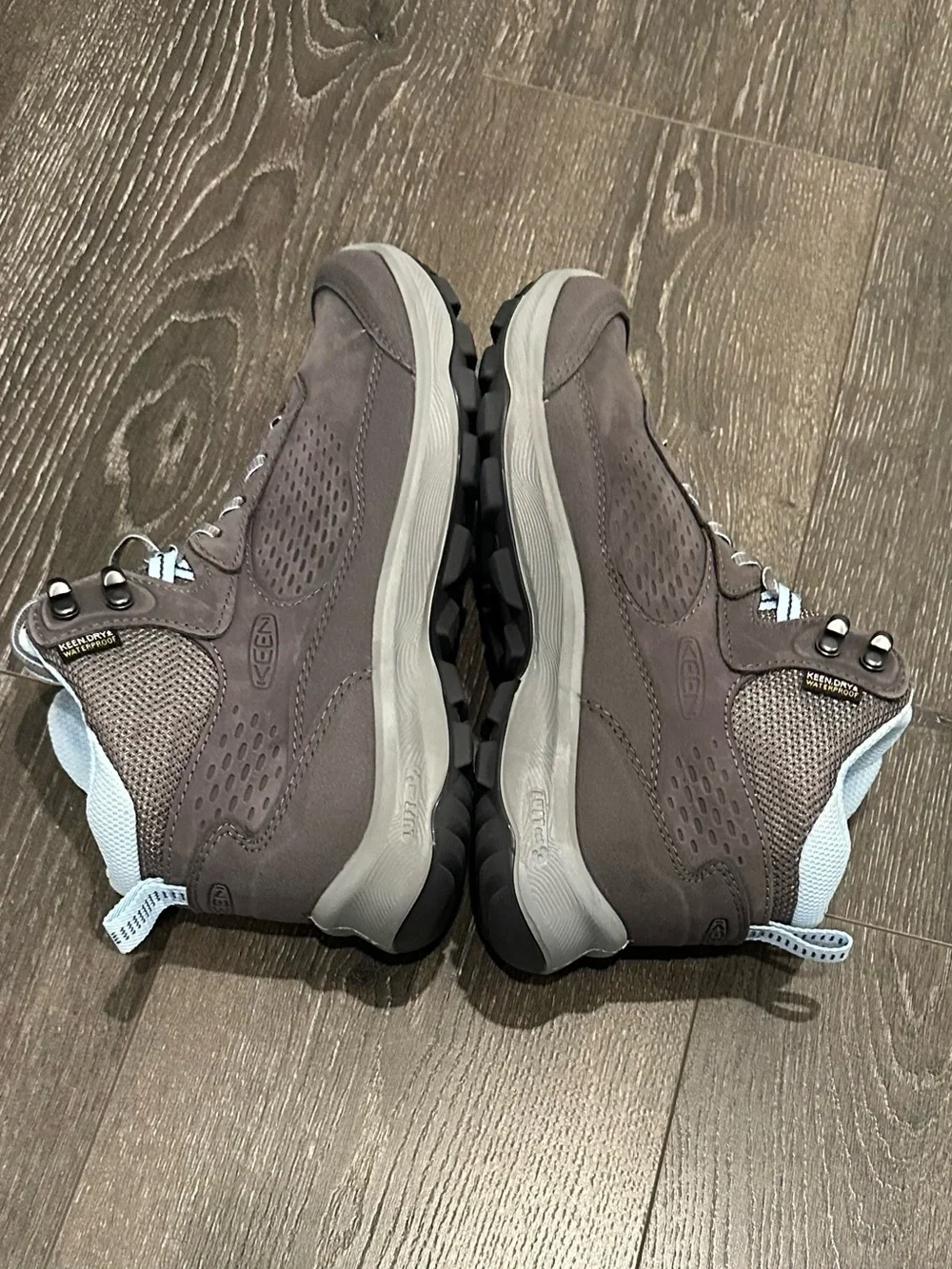 KEEN Gray Lace-Up Women's Hiking Boots with Light Blue Lining.